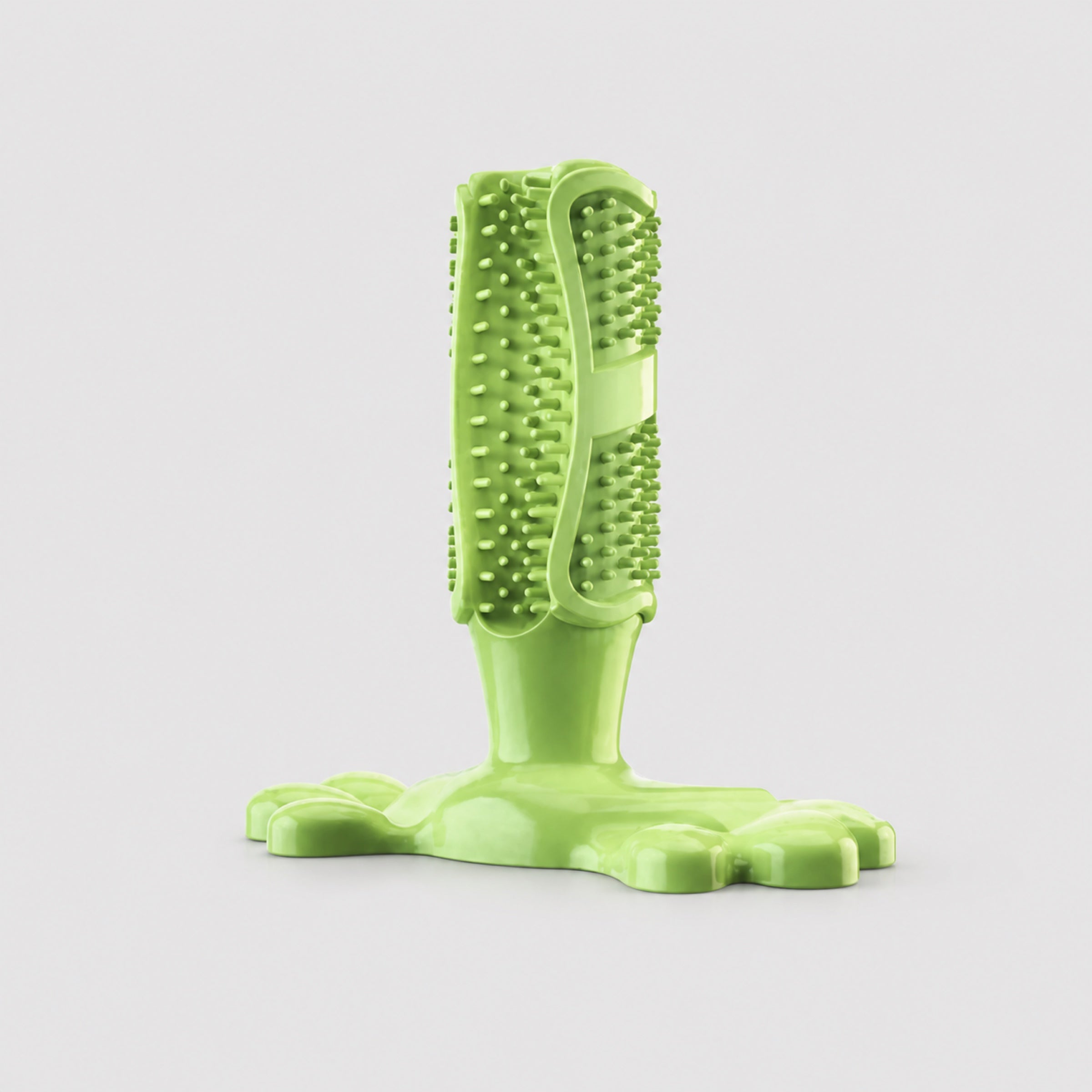 Green cactus dog chew toy treat dispenser dental toothbrush on light grey background