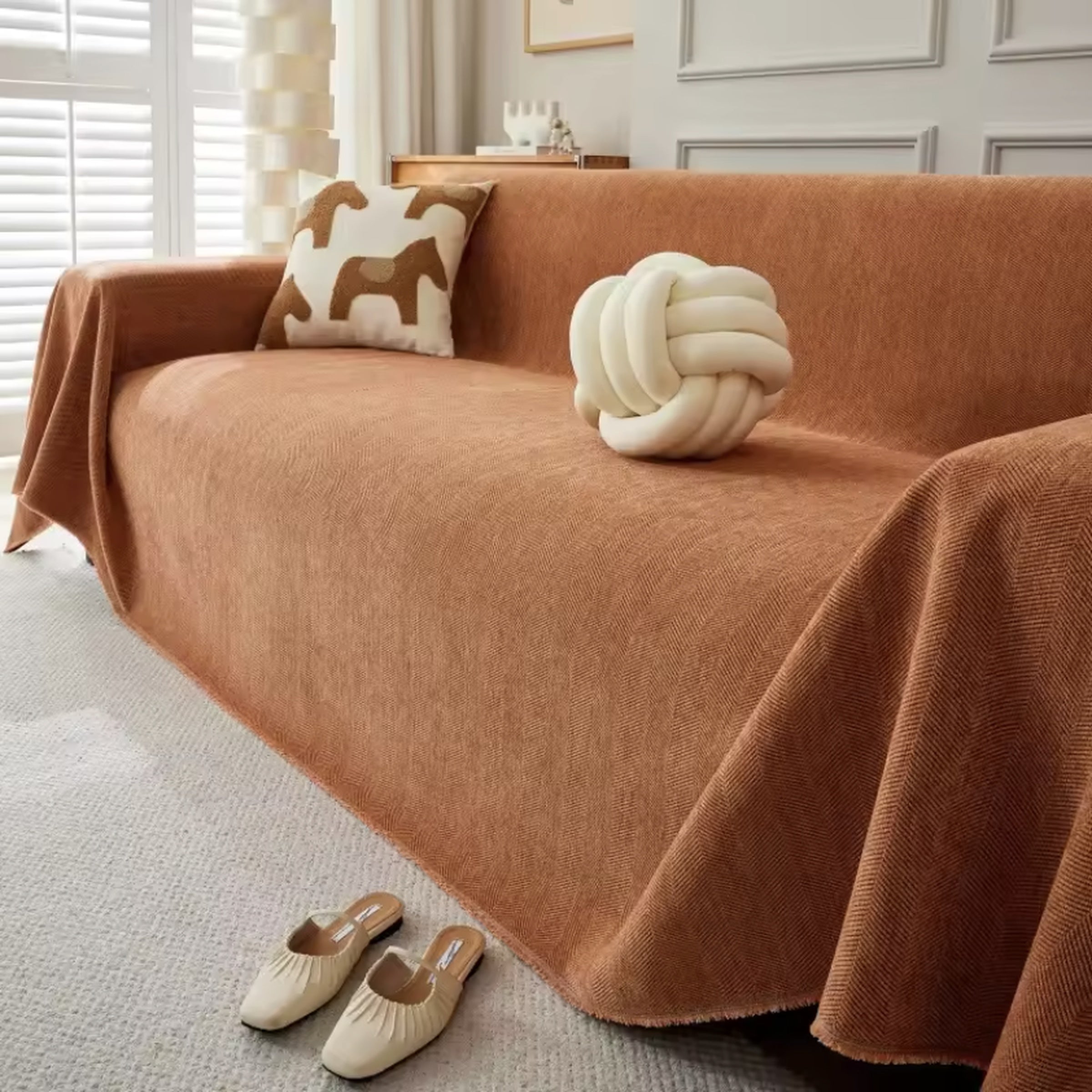 Orange geometric stretch sofa cover in living room
