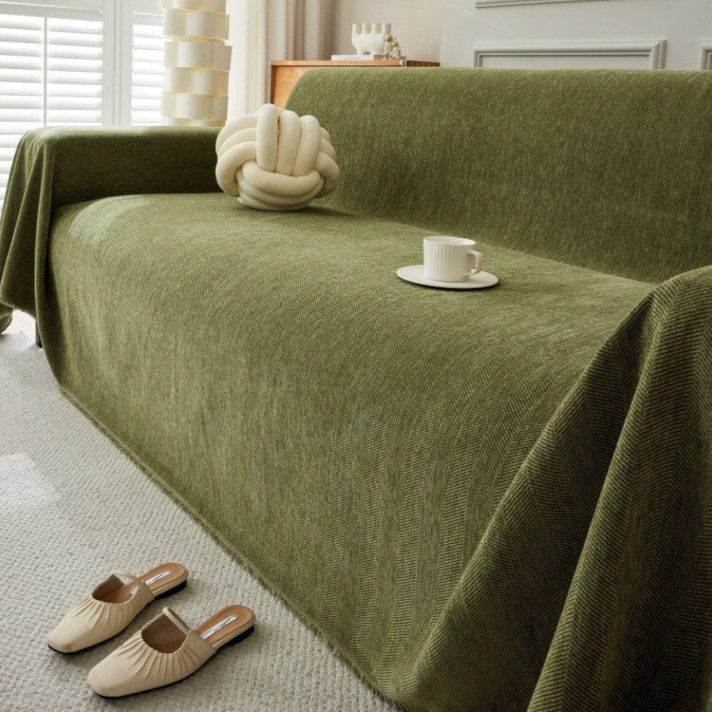 Stylish geometric green sofa cover in living room